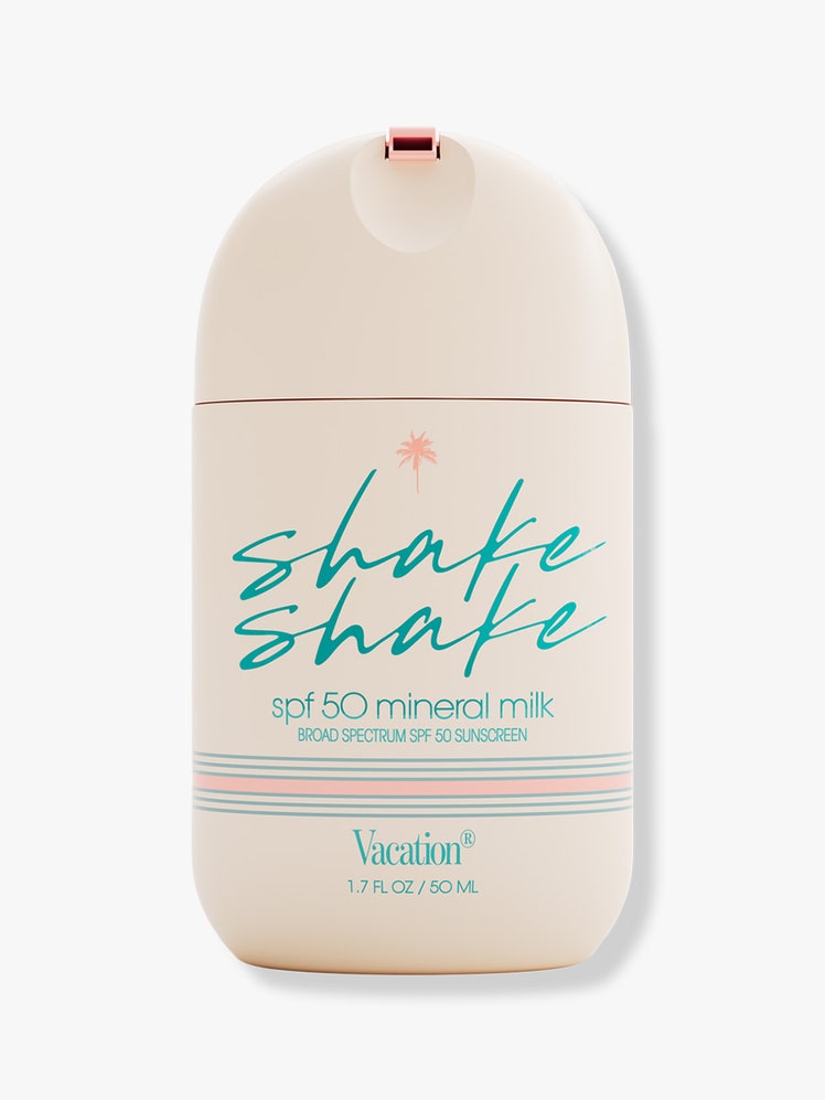 Vacation Shake Shake SPF 50 Mineral Milk Face Sunscreen in beige rounded bottle on light grey background