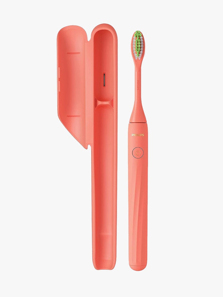 Philips One in coral color next to case on light grey background