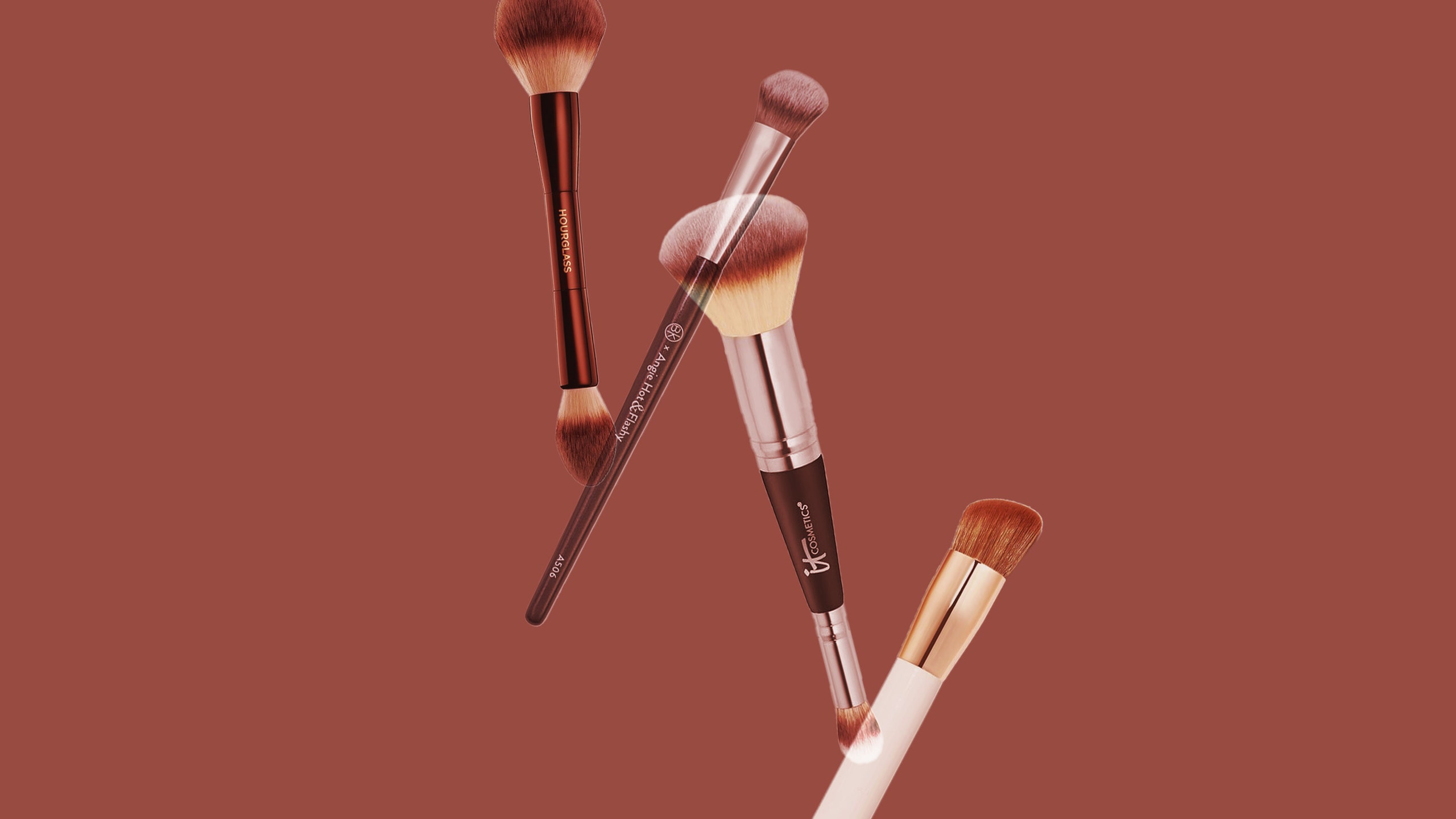 4 makeup brushes overlapping on a brown background