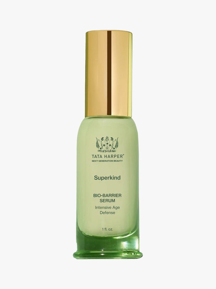 Tata Harper Superkind Bio-Barrier Serum in green bottle with gold cap on light grey background