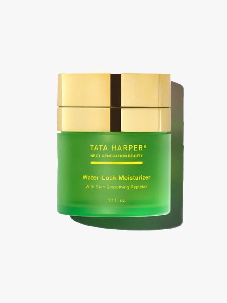 Tata Harper Water Lock Moisturizer green jar with gold lid on light grey background