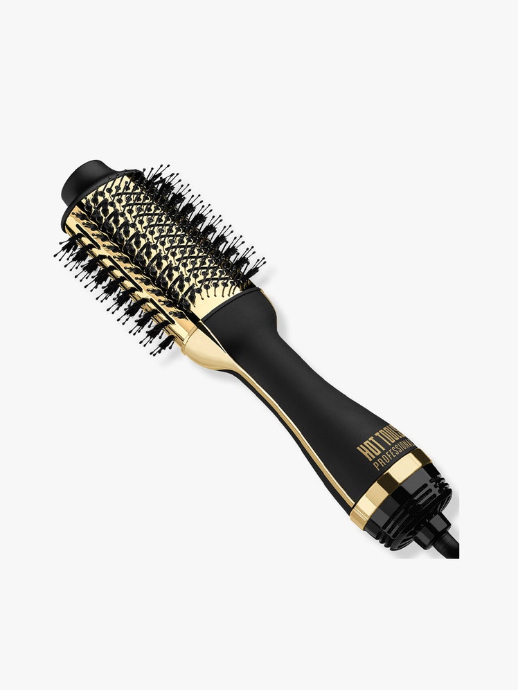 Hot Tools 24K Gold One-Step Hair Dryer and Volumizer gold and black round hair dryer brush on light gray background