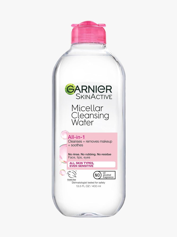 Garnier Micellar Cleansing Water clear bottle of micellar water with pink cap on light gray background