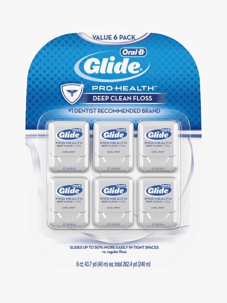 Oral-B Glide Pro-Health Dental Floss (6-Pack) package of six gray containers of floss on light gray background