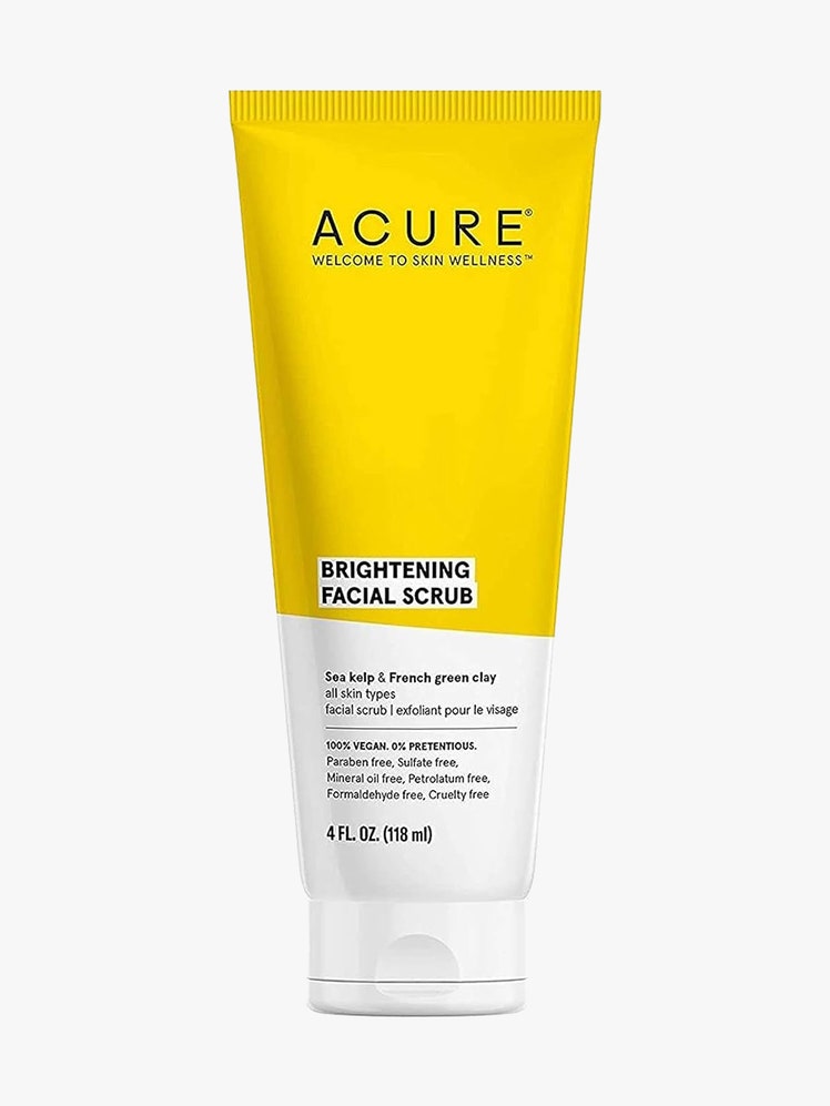 Acure Brightening Facial Scrub yellow and white tube on light gray background