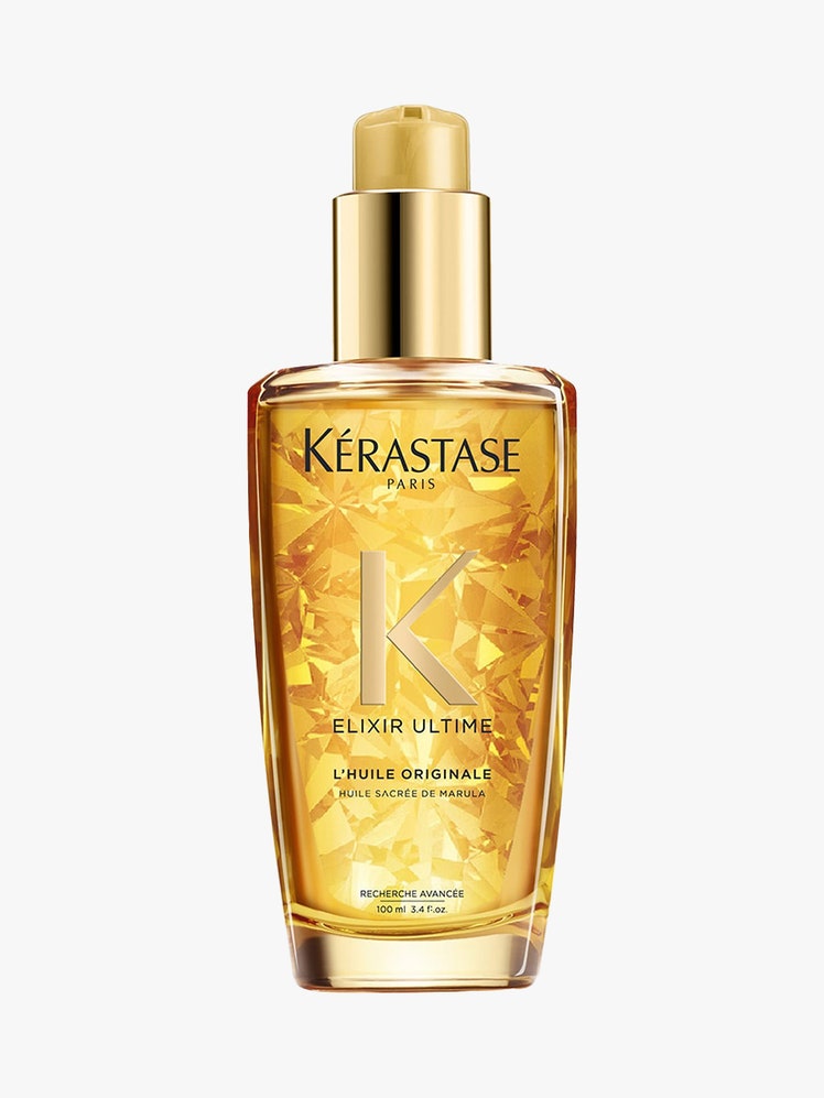 Kérastase L'Huile Original Hair Oil in gold bottle on light grey background