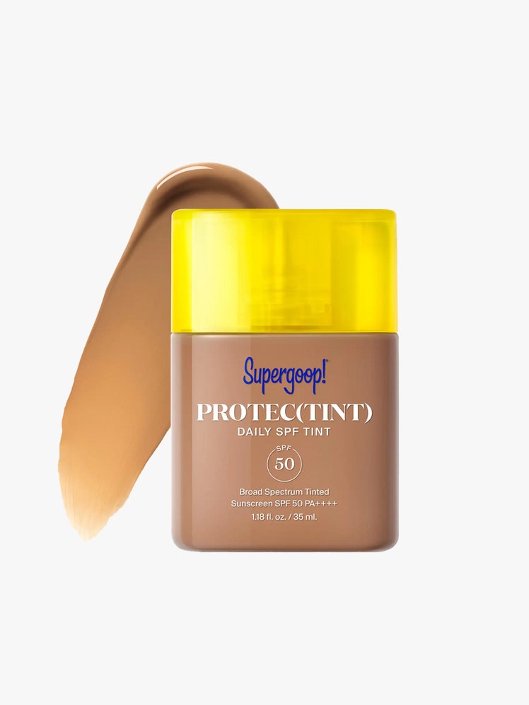 Supergoop Protec(tint) Daily SPF Tint SPF 50 in a clear bottle with a yellow cap on an off-white background