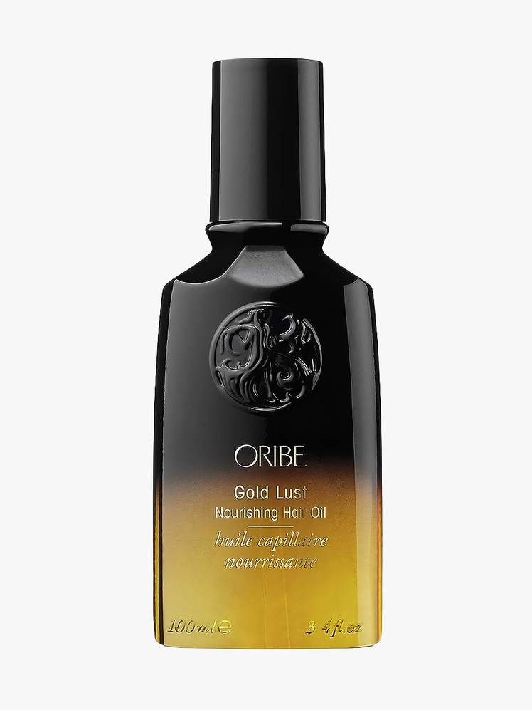 Oribe Gold Lust Nourishing Hair Oil in branded black and gold gradient bottle on light gray background