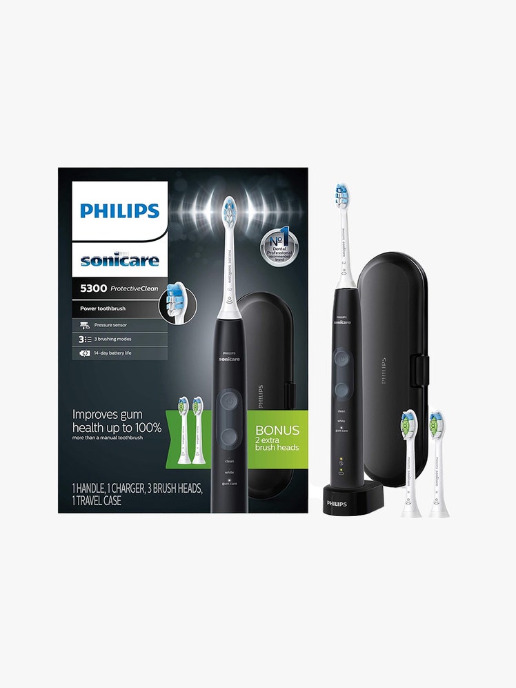 Philips Sonicare ProtectiveClean 5300 black box, electric toothbrush, case, and two brush heads on light gray background