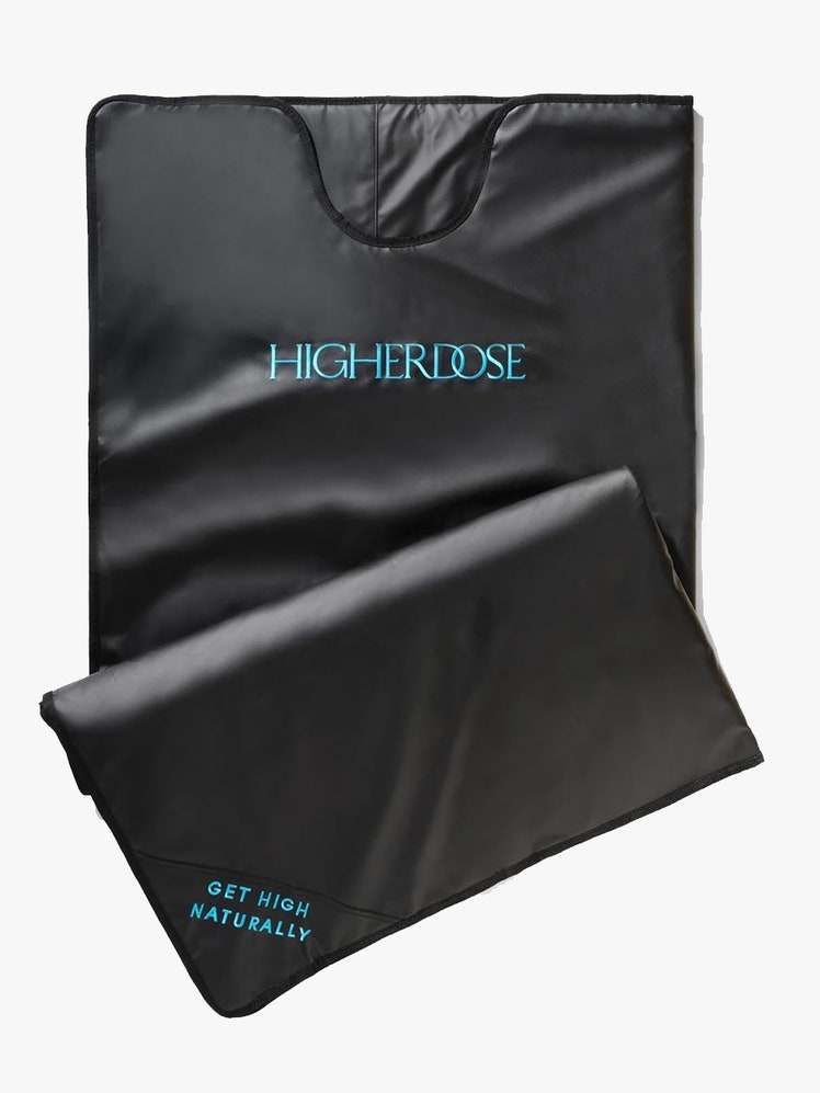 The black HigherDose Infrared Sauna Blanket on a light gray background