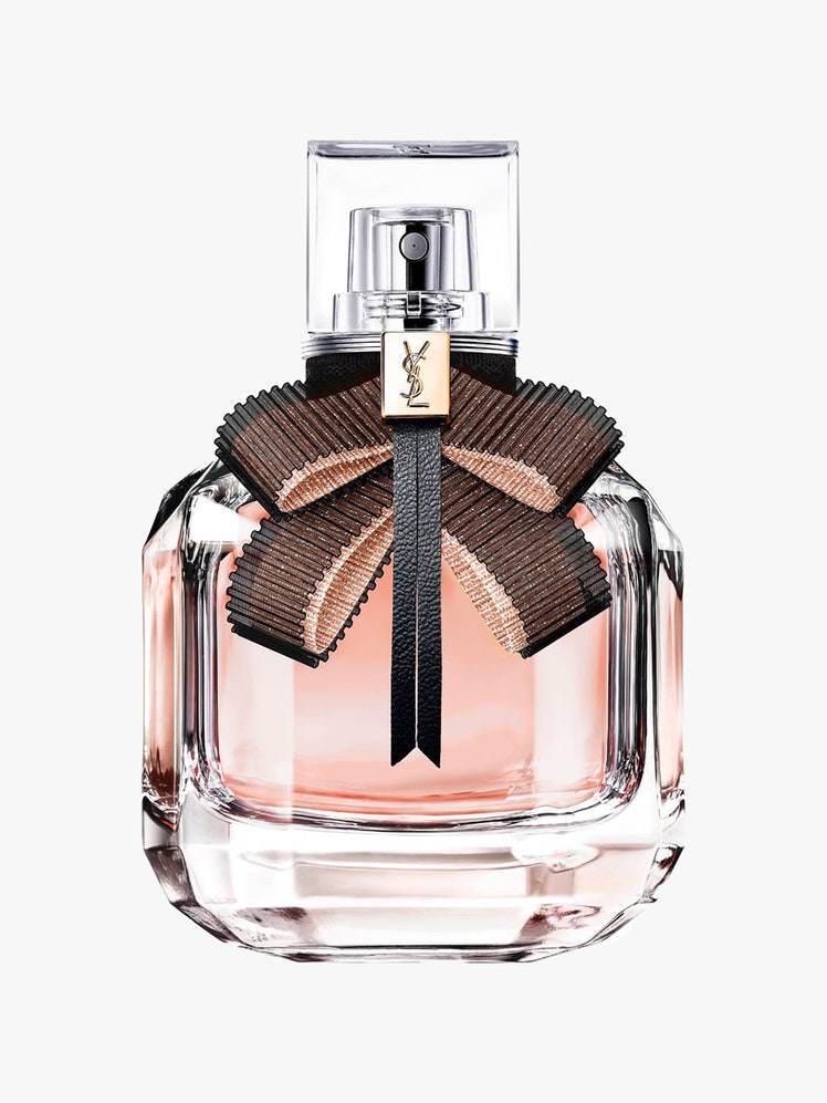 A perfume bottle of the Yves Saint Laurent Mon Paris Lumière Eau de Toilette on a light gray background