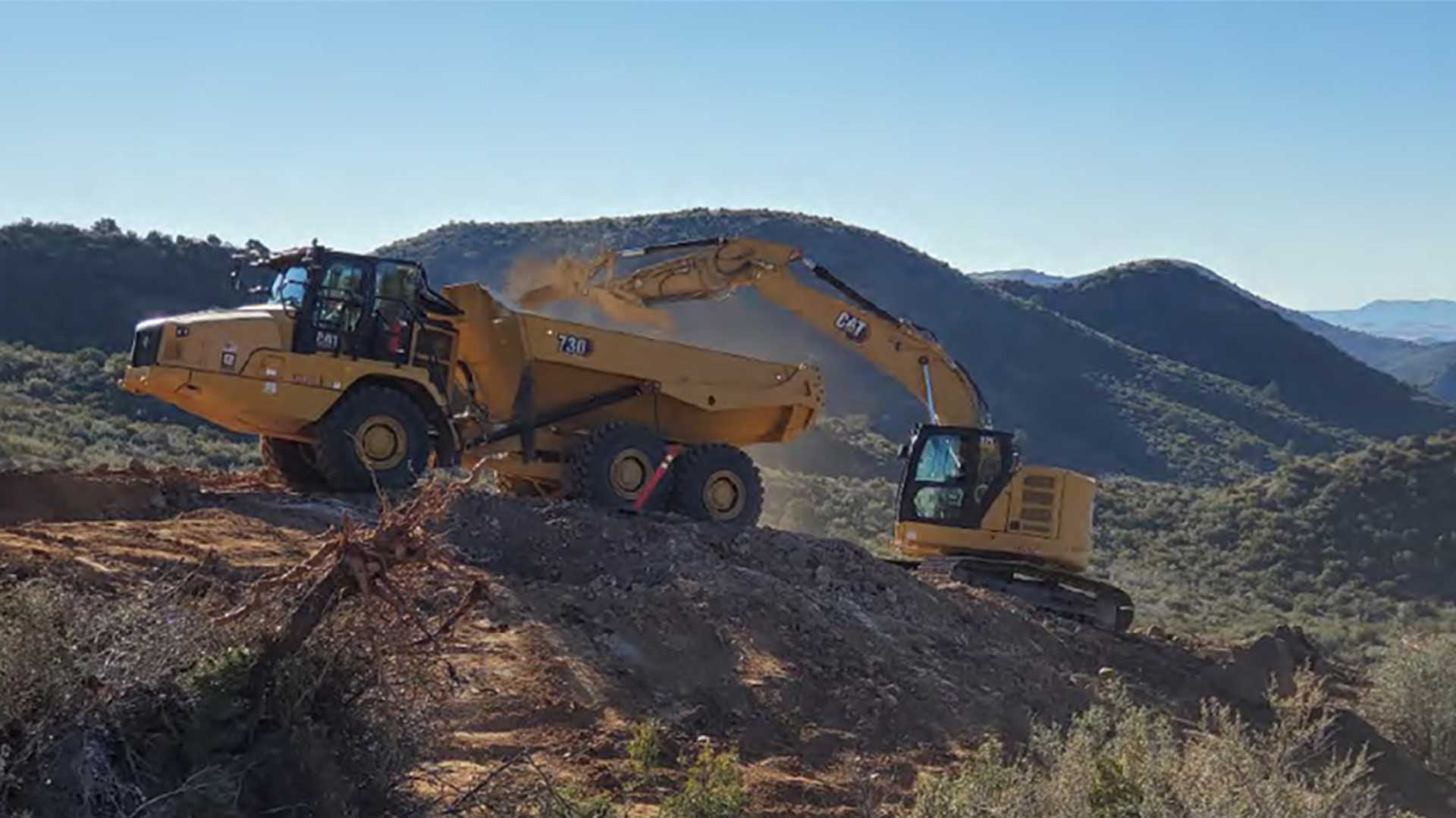 Abandoned mine cleanup crews load waste at the Golden Idol Mine in the Cherry Creek Mining District in Yavapai County in December 2021. 