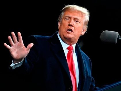 US President Donald Trump gestures as he speaks at a rally to support Republican Senate ca