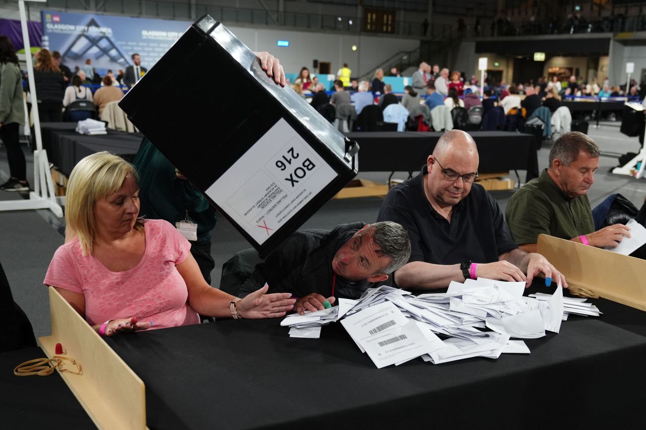 Ballot boxes are emptied at Emirates Arena in Glasgow, Scotland, on Thursday, July 4. 