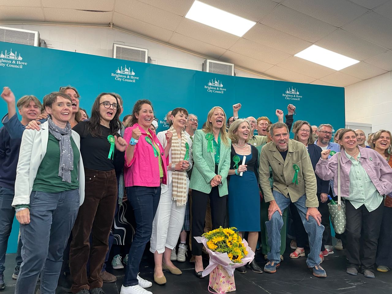 Sian Berry and Green Party supporters celebrate at the Portslade Sports Centre after winning the seat in the Brighton Pavilion constituency in the 2024 General Election on July 4.