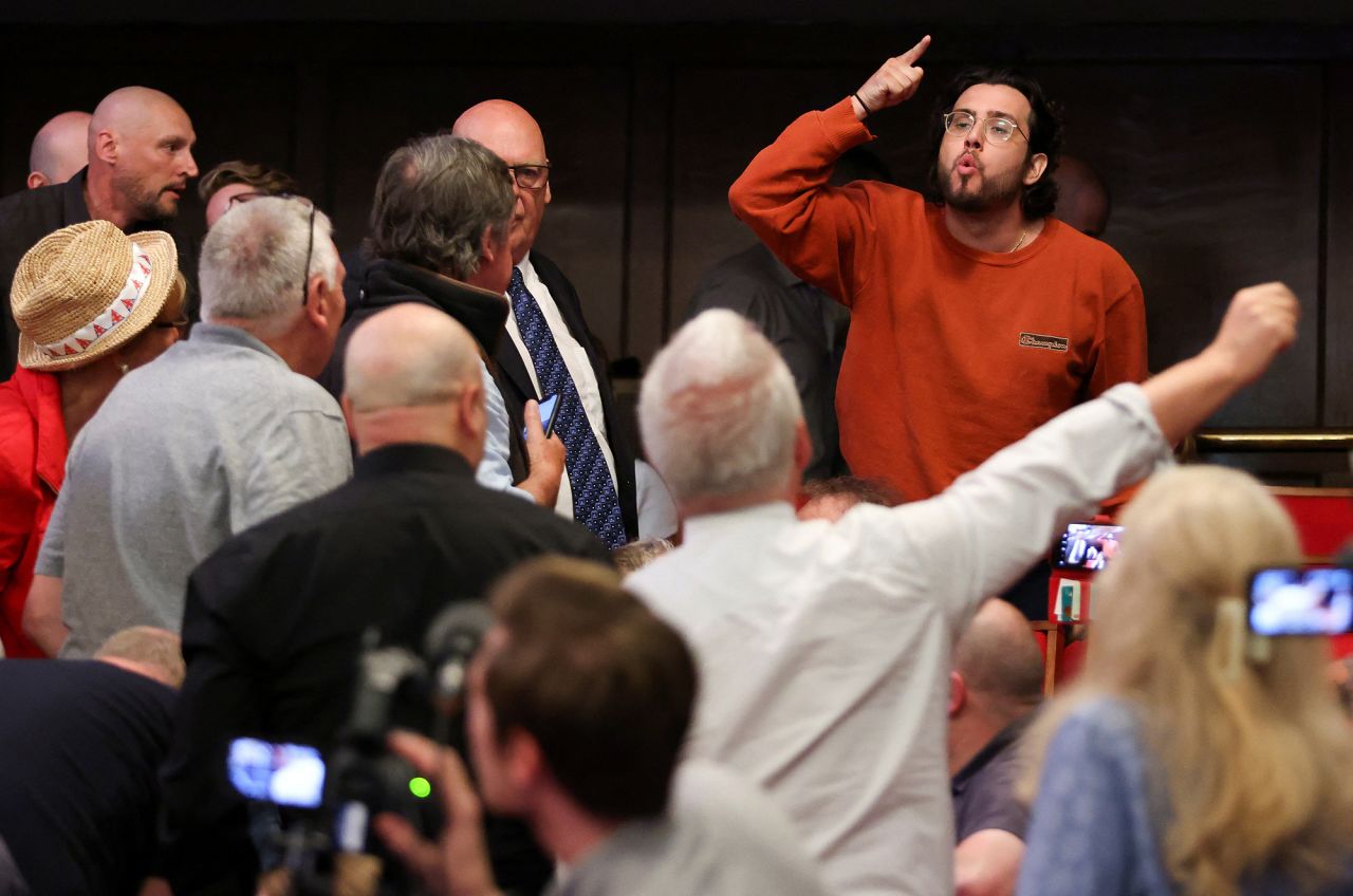 A heckler gestures as Britain's Reform UK Party Leader Nigel Farage speaks to the media, in London, England, on July 5.