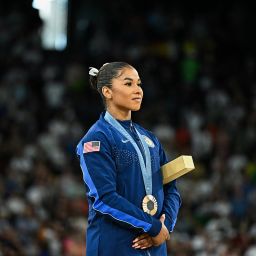 Jordan Chiles poses with the bronze medal during the podium ceremony for the artistic gymnastics women's floor exercise on August 5. 