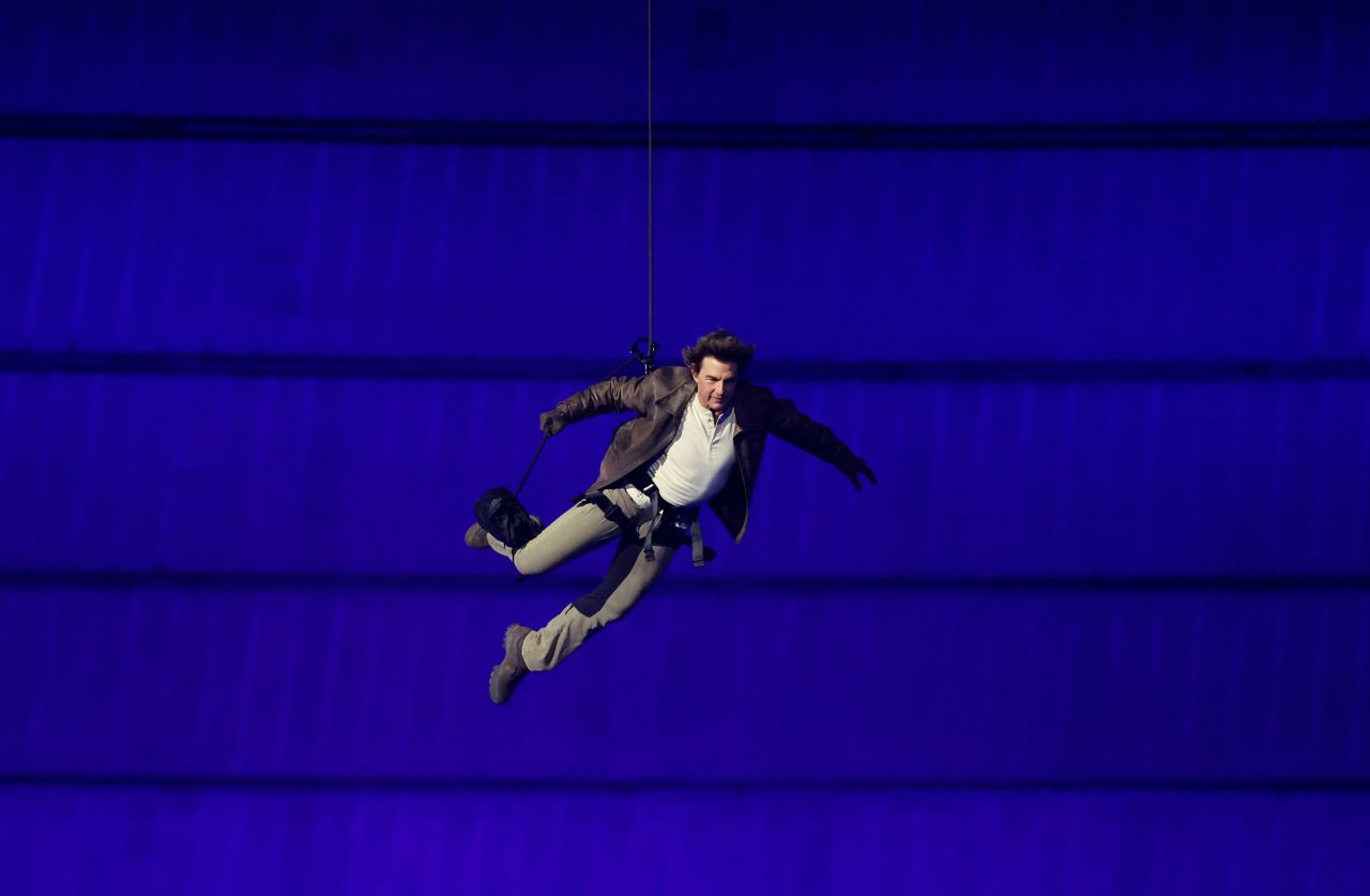 Actor Tom Cruise jumps from the roof of the Stade de France. 