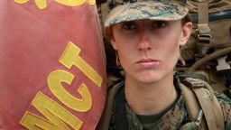 CAMP LEJEUNE, NC - FEBRUARY 22:  Pfc. Tiffany Mash of Torrance, California leads a company of Marines, both male and female, carrying 55 pound packs at the start of a 10 kilometer training march during Marine Combat Training (MCT) on February 22, 2013 at Camp Lejeune, North Carolina.  Since 1988 all non-infantry enlisted male Marines have been required to complete 29 days of basic combat skills training at MCT after graduating from boot camp. MCT has been required for all enlisted female Marines since 1997. About six percent of enlisted Marines are female.  (Photo by Scott Olson/Getty Images)