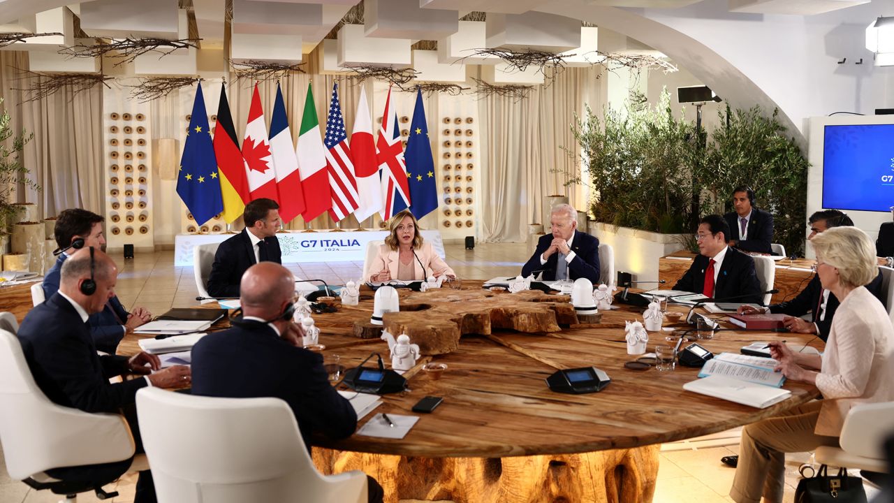 ?Italy's Prime Minister Giorgia Meloni, U.S. President Joe Biden, French President Emmanuel Macron, Canada's Prime Minister Justin Trudeau, German Chancellor Olaf Scholz, Britain's Prime Minister Rishi Sunak, Japan's Prime Minister Fumio Kishida attend a session on Africa, climate change and development on the first day of the G7 summit at the Borgo Egnazia resort, in Savelletri, Italy, June 13, 2024. REUTERS/Yara Nardi