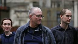 From right: Evan Gershkovich, Paul Whelan and Alsu Kurmasheva, who were released from detention in Russia, look on at Kelly Field in San Antonio, Texas on August 2, 2024.