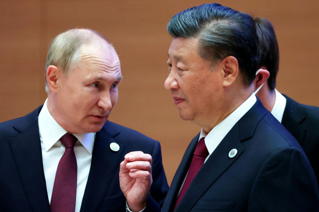 Russian President Vladimir Putin, left, gestures while speaking to Chinese President Xi Jinping during the Shanghai Cooperation Organization (SCO) summit in Samarkand, Uzbekistan, Friday, Sept. 16, 2022. (Sergei Bobylev, Sputnik, Kremlin Pool Photo via AP)