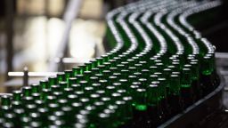 Bottles of Heinken beer travel along the production line at the Heineken NV brewery in Saint Petersburg, Russia, on Wednesday, Nov. 18, 2015. 