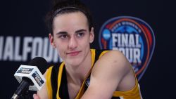 CLEVELAND, OHIO - APRIL 07: Caitlin Clark #22 of the Iowa Hawkeyes talks with the media after losing to the South Carolina Gamecocks in the 2024 NCAA Women's Basketball Tournament National Championship at Rocket Mortgage FieldHouse on April 07, 2024 in Cleveland, Ohio. South Carolina beat Iowa 87-75. (Photo by Steph Chambers/Getty Images)