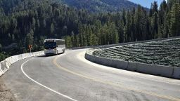 A bus drives on Wyoming Highway 22/Teton Pass, which was reopened to traffic on Friday, June 28.