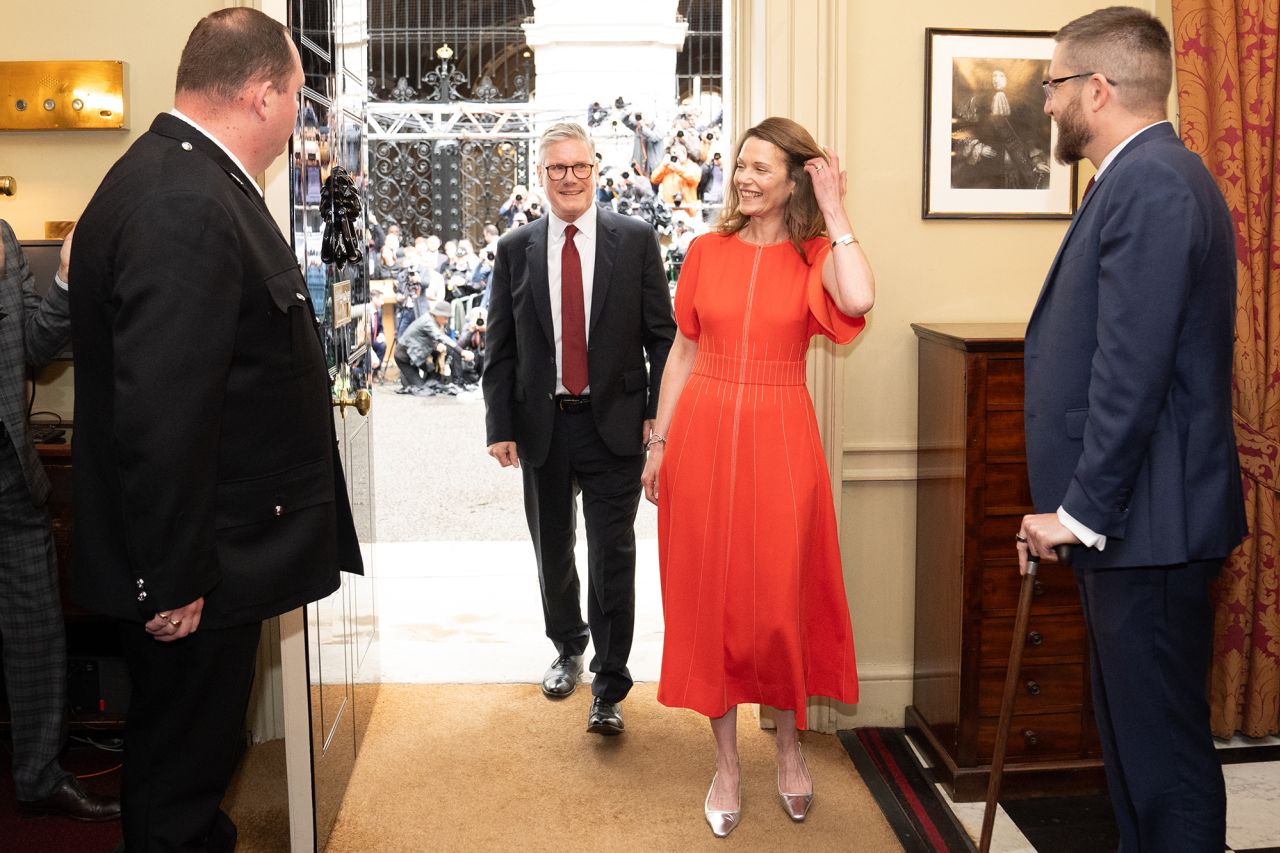 Newly elected Prime Minister Sir Keir Starmer with his wife Victoria Starmer enter his official London residence at No 10 Downing Street.