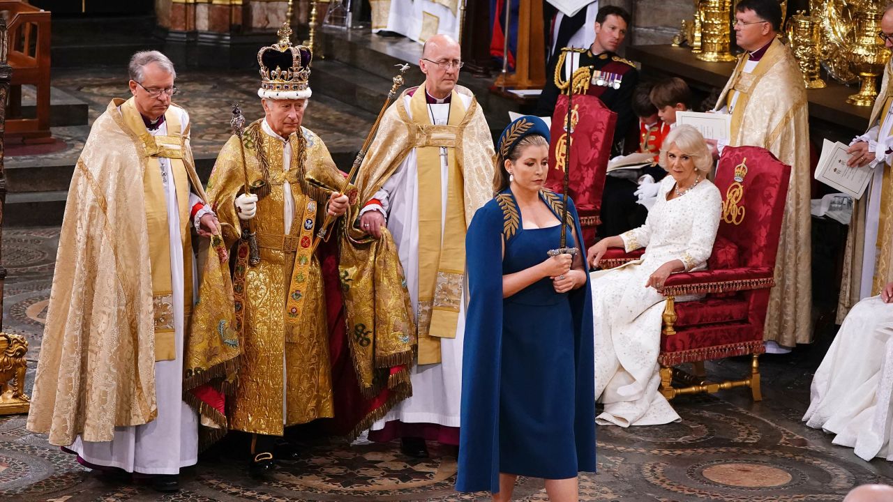 Penny Mordaunt leads King Charles III during his coronation ceremony in Westminster Abbey in London, on May 6, 2023. 