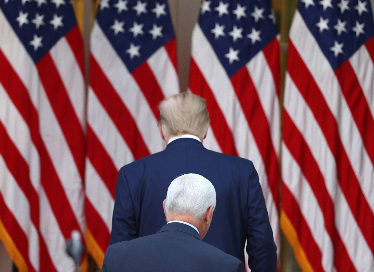 President Donald Trump and Vice President Mike Pence walk away after speaking about Operation Warp Speed in the Rose Garden at the White House on November 13, 2020 in Washington, DC.