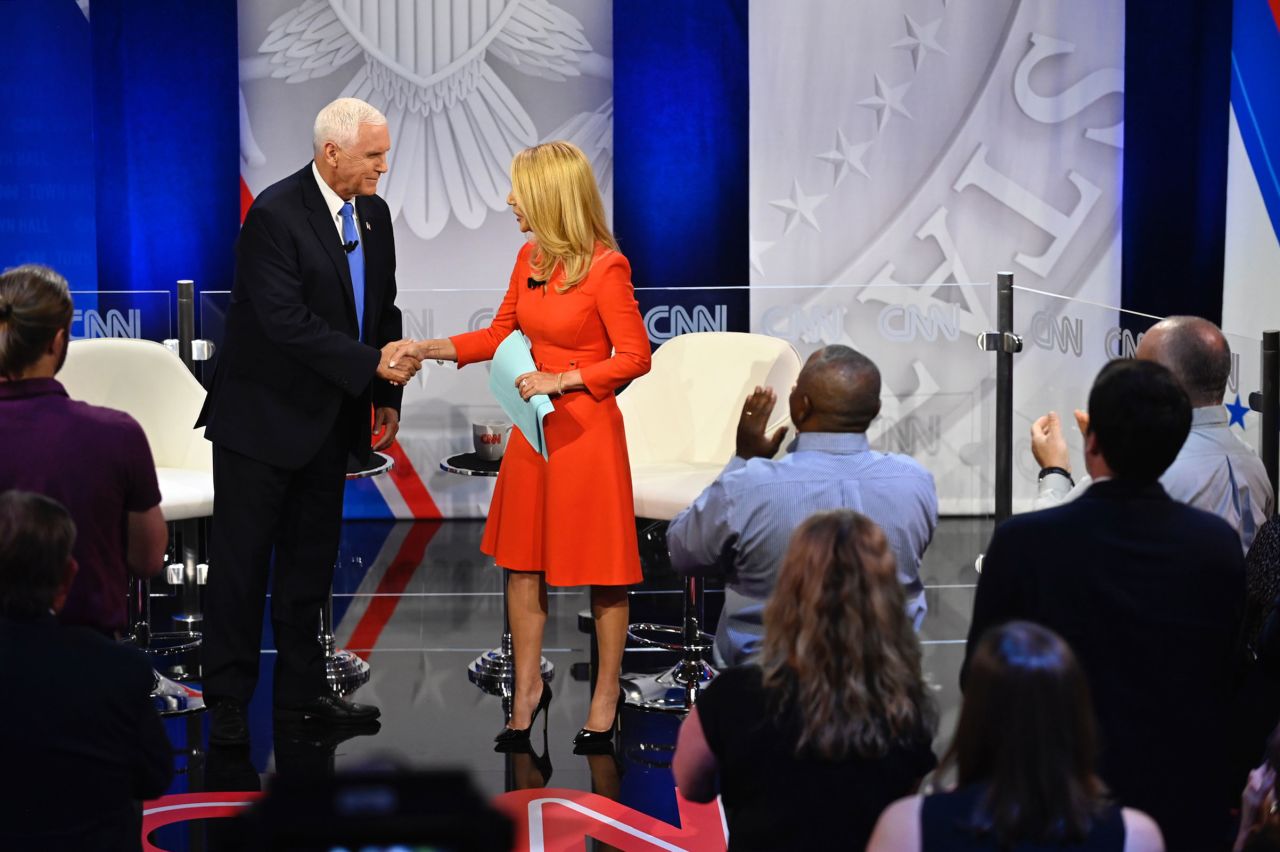 Former Vice President Mike Pence shakes hands at the start of a CNN Republican Presidential Town Hall moderated by CNN’s Dana Bash at Grand View University in Des Moines, Iowa, on Wednesday, June 7.