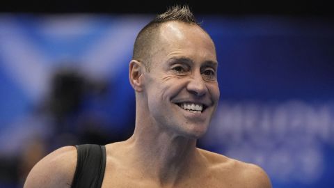 Bill May, of the United States, walks along the pool deck at the World Swimming Championships in Fukuoka, Japan, Saturday, July 15, 2023. Largely unnoticed by the general public, men have been participating in artistic swimming, formerly known as synchronized swimming, for decades. (AP Photo/Nick Didlick)