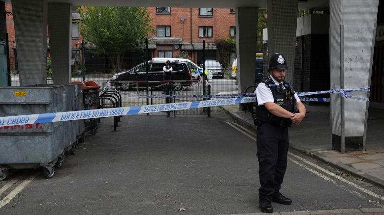 Police officers at an address in Shepherd's Bush, west London, after human remains were found in two suitcases near the Clifton Suspension Bridge in Bristol. Picture date: Friday July 12, 2024. 76829061 (Press Association via AP Images)