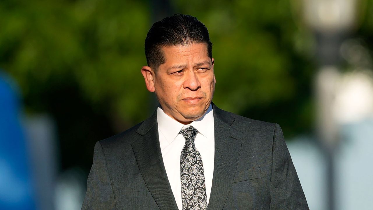 Former Uvalde Consolidated Independent School District police officer Adrian Gonzales, left, arrives at the Uvalde County Courthouse, Thursday, July 25, 2024, in Uvalde, Texas. Gonzales made his first court appearance on charges of abandoning and failing to protect children. (AP Photo/Eric Gay)