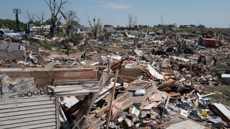 GREENFIELD, IOWA - MAY 22: Residents go through the damage after a tornado tore through town yesterday afternoon on May 22, 2024 in Greenfield, Iowa. Multiple deaths and injuries have been reported from a series of tornadoes and powerful storms that hit several Midwestern states.  (Photo by Scott Olson/Getty Images)