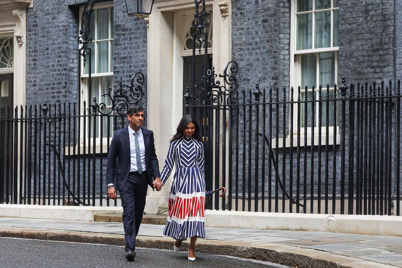 Outgoing British Prime Minister Rishi Sunak walks with his wife Akshata Murty after delivering a speech at Number 10 Downing Street, following the results of the elections, in London, England, on July 5.