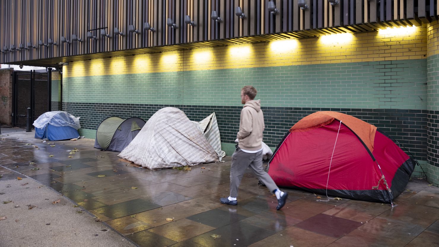 Homeless people pitch tents on a pavement in Whitechapel, east London, in December 2023. Rough sleeping in England is 61% higher than it was 10 years ago, according to homelessness charity Crisis.