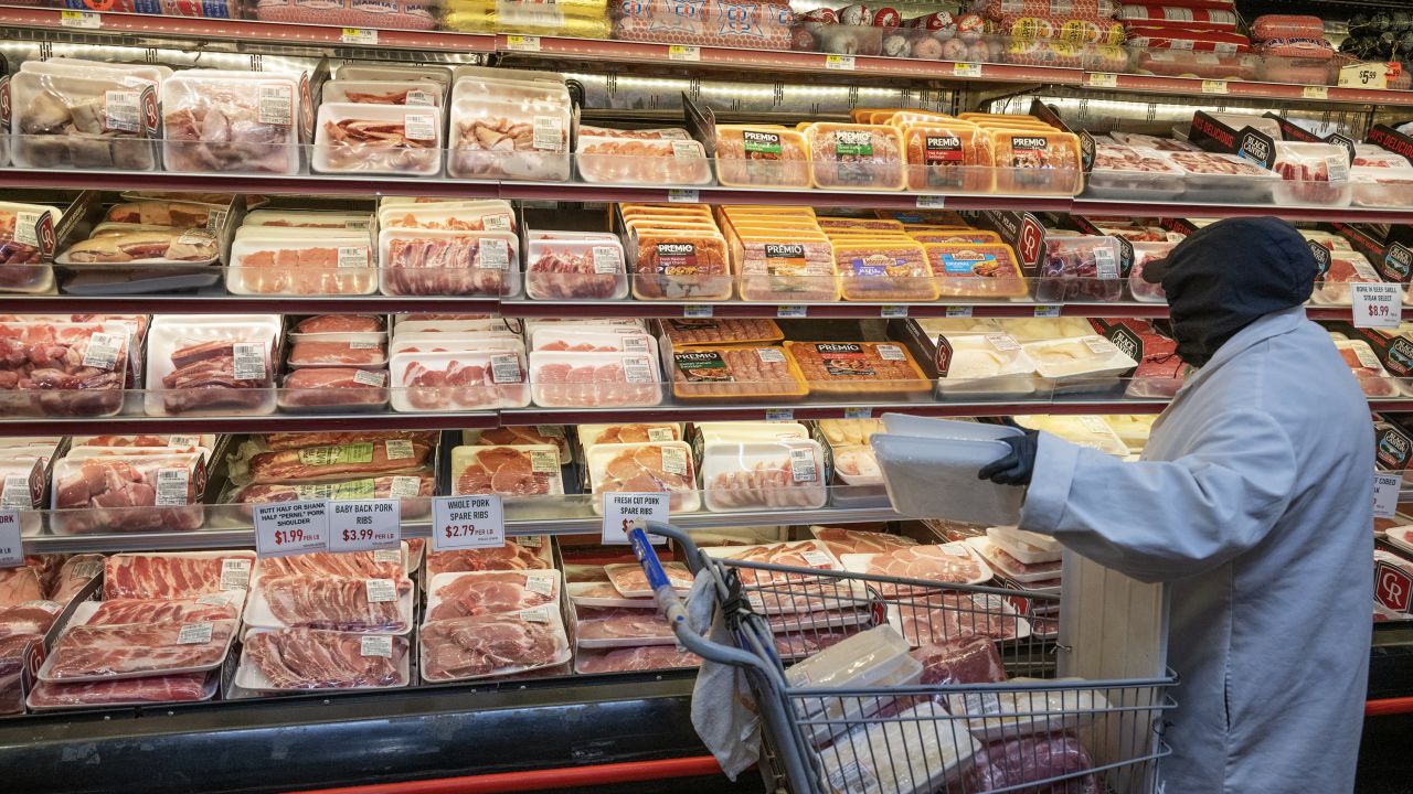 A worker stocks cuts of meat at a Shop Fair Market in the Brooklyn borough of New York, US, on Tuesday, Dec. 26, 2023.