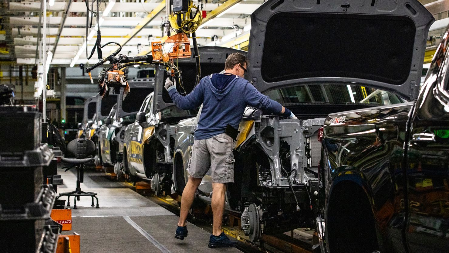 A worker installs an engine at the General Motors assembly plant in Fort Wayne, Indiana, on April 9.