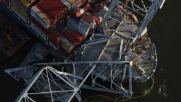 BALTIMORE, MARYLAND - APRIL 09:  In an aerial view, salvage crews continue to remove wreckage from the cargo ship Dali after it stuck and collapsed the Francis Scott Key Bridge, April 09, 2024 in Baltimore, Maryland. The Unified Command has started removing containers from the Dali while also working to clear the channel to restore the flow of commerce to the Port of Baltimore. The bridge collapsed after being struck by the 984-foot cargo ship Dali at 1:30 AM on March 26. (Photo by Kevin Dietsch/Getty Images)