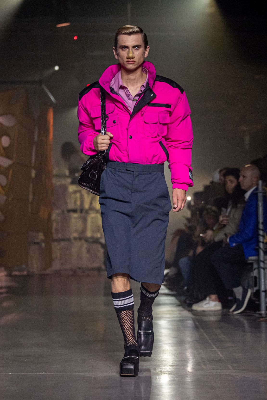 Her collection features hot-pink cagoules tucked into pencil skirts.