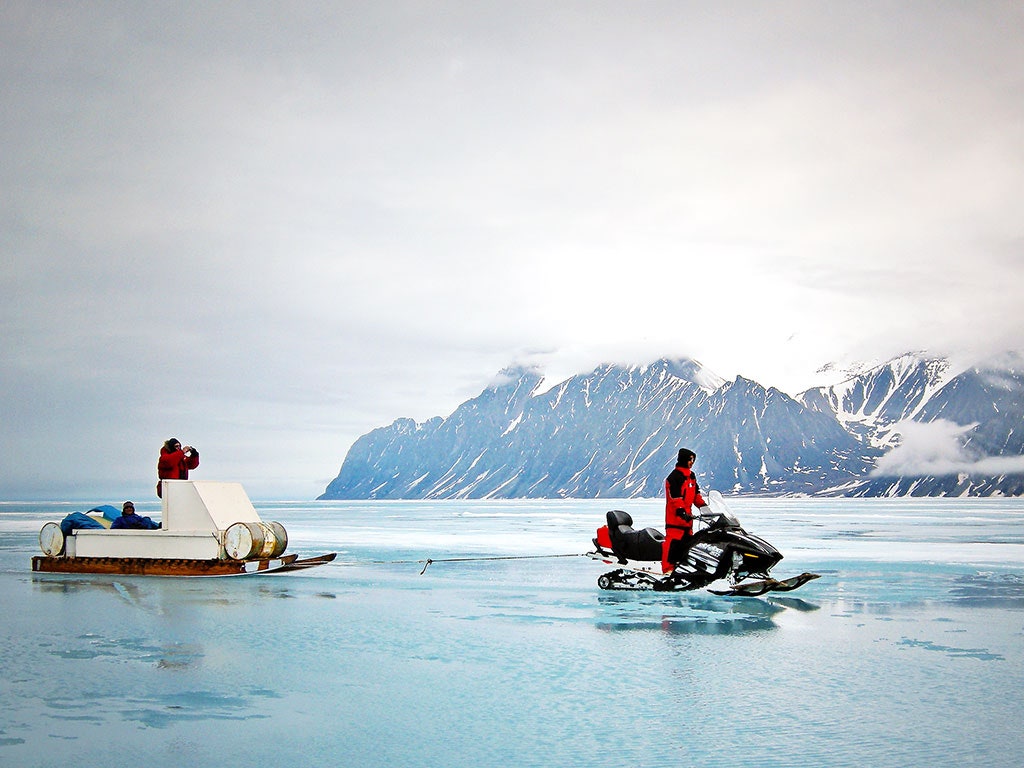 Image may contain Transportation Vehicle Boat Human Person Nature Outdoors Ice Mountain and Snow