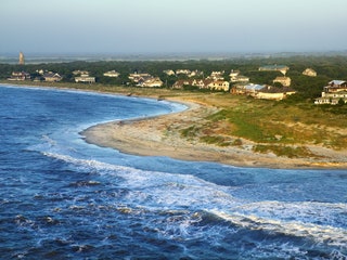 Image may contain Ocean Outdoors Nature Water Sea Shoreline Land Coast Promontory Landscape Scenery and Beach