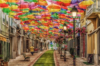 street with umbrella's overhead