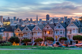 homes along a street with city in background