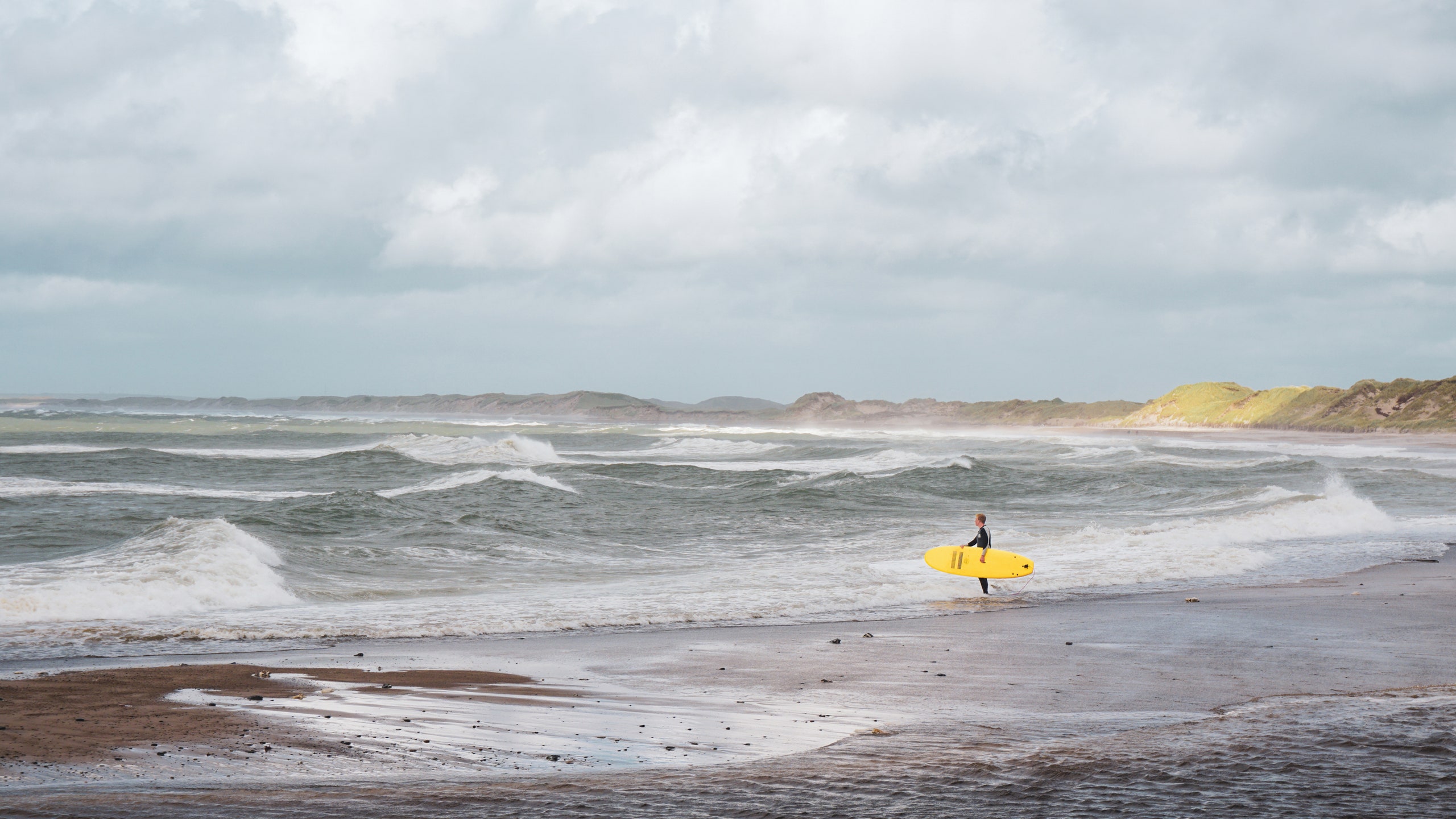 Image may contain Nature Outdoors Sea Water Sea Waves Beach Coast Shoreline Sky Person Scenery and Horizon