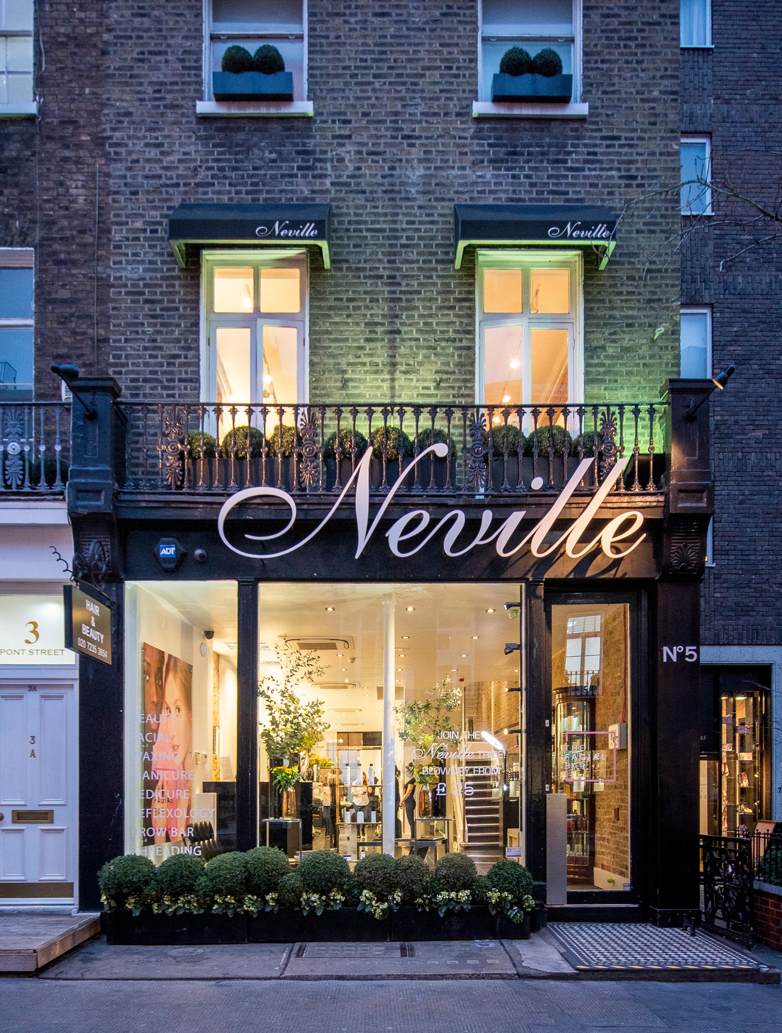 the exterior of Neville salon in Belgravia in evening light