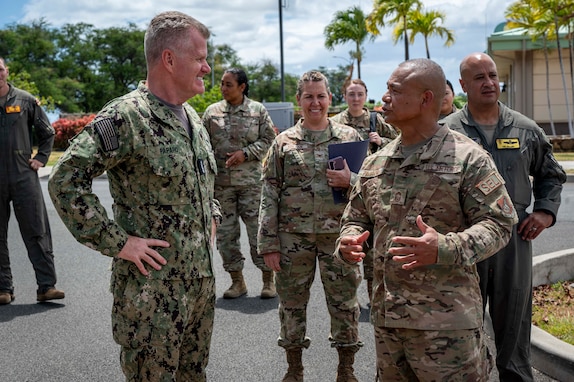 Adm. Samuel J. Paparo, commander of U.S. Indo-Pacific Command, speaks with service members from Hawai'i Air National Guard’s 154th Force Support Squadron during his visit on Joint Base Pearl Harbor-Hickam, Hawai'i, on Aug. 12, 2024.